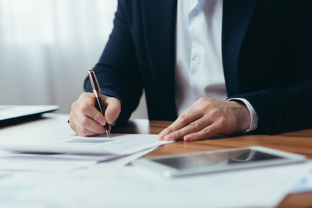 Businessman signing documents