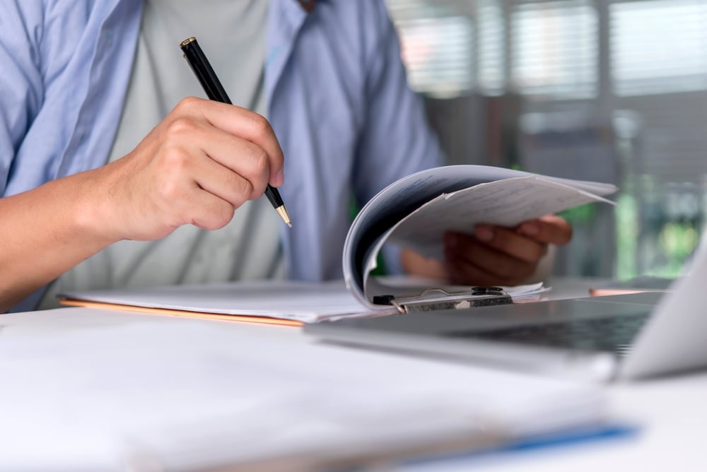 Photo of a person reviewing safety policy documents