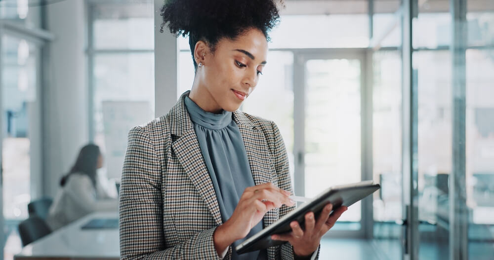 Woman viewing telematics checklist for commercial insurance on a tablet