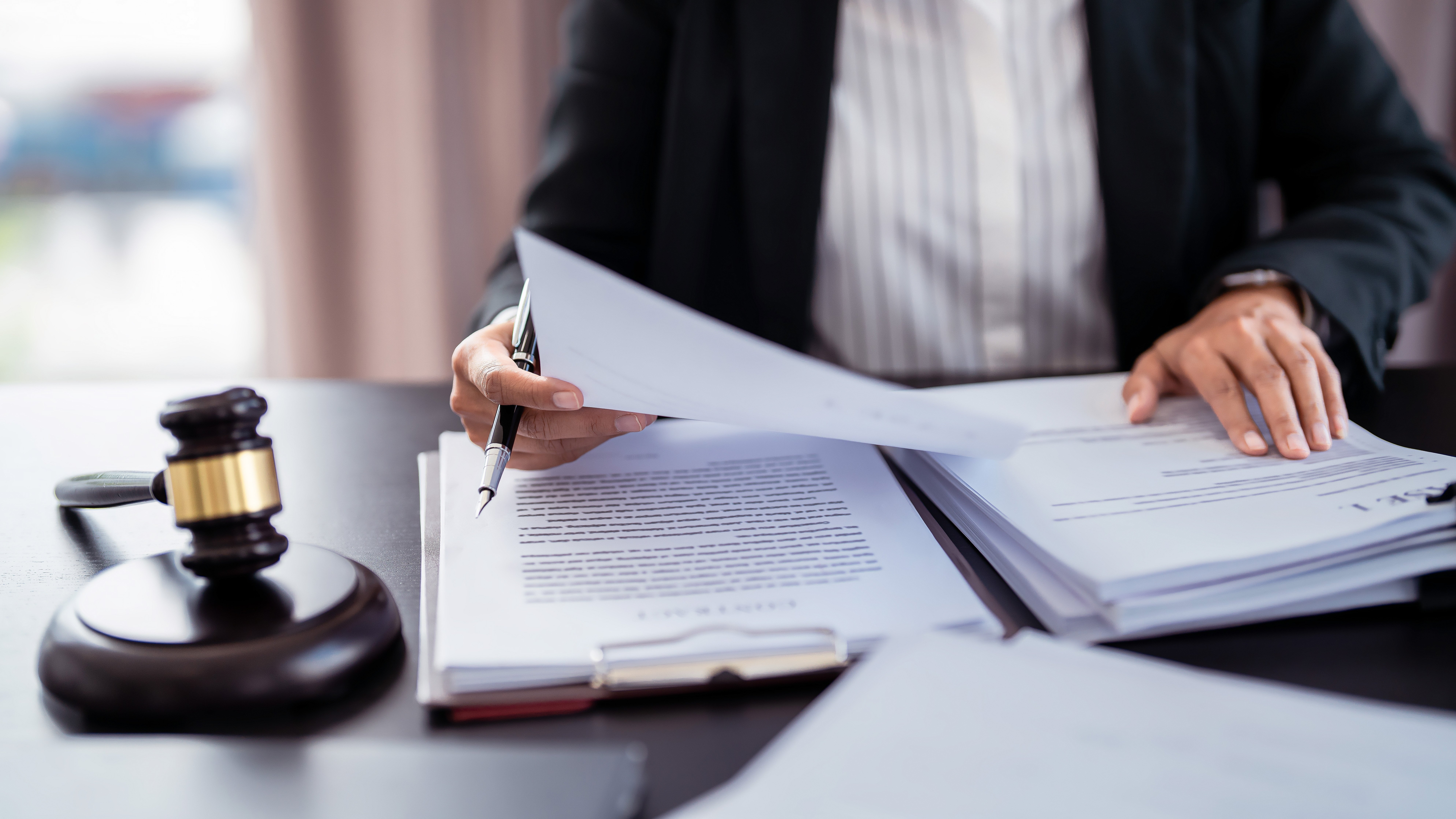 Photo of lawyer reviewing documents to promote SambaSafety's solutions for preventing nuclear verdicts in fleet litigation