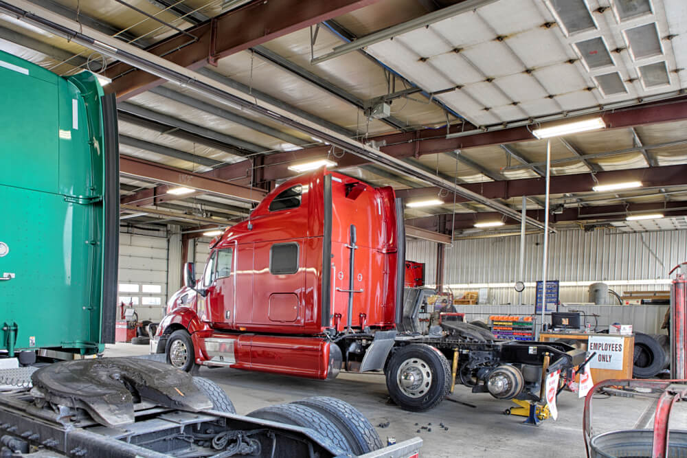 Semi truck in auto body shop to highlight severity in insurance