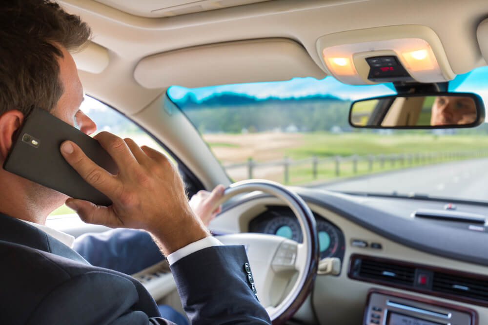 image of distracted company driver showcasing the need to improve fleet safety