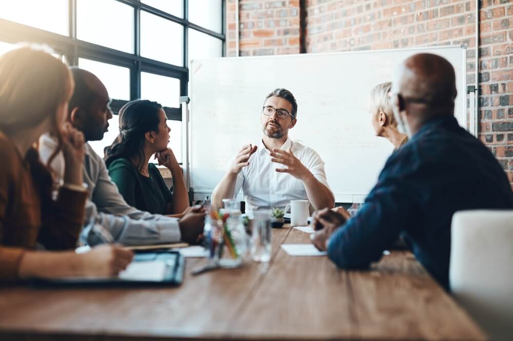 team-of-underwriters-meeting-about-loss-runs-in-insurance